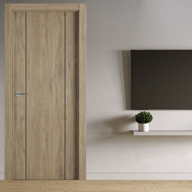 puerta laminada g1006 roble urban greca negra perciber instalada en ambiente moderno con pared clara y decoración minimalista