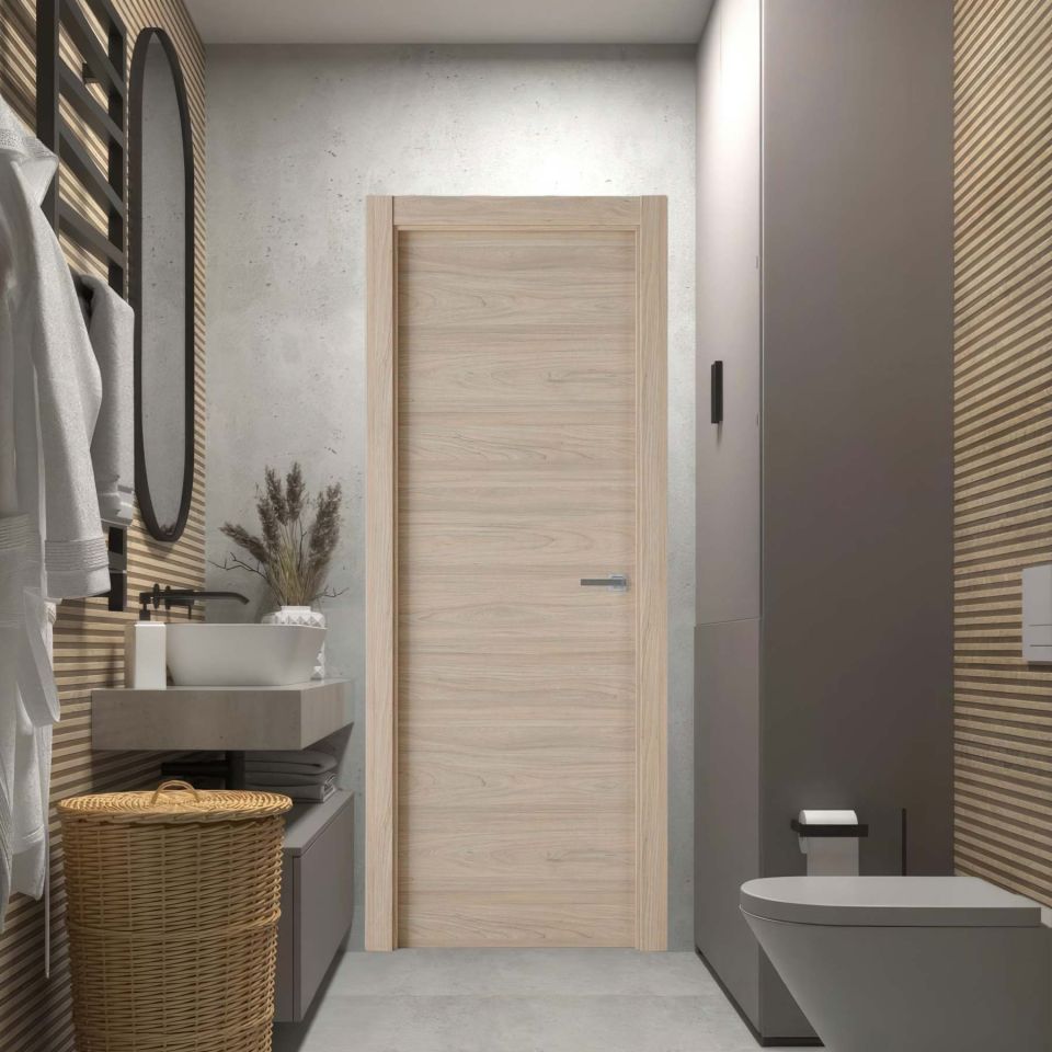 Puerta laminada modelo X1000 en color Roble Estrío instalada en un baño moderno, diseño Perciber.