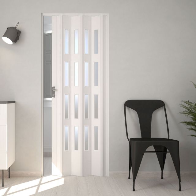 puerta plegable pvc blanca con cristal instalada en una habitacion moderna