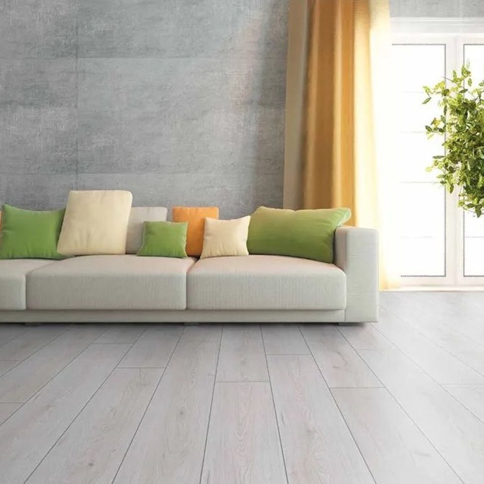 Suelo laminado roble blanco D3201 instalado en una habitación moderna