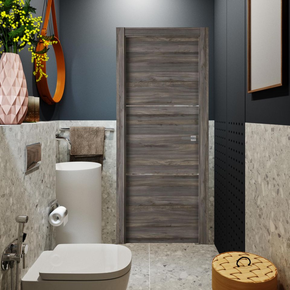 Puerta laminada X2002 Vulcano Greca Blanca instalada en un baño moderno con paredes grises, cerámica marmoleada y decoración minimalista.